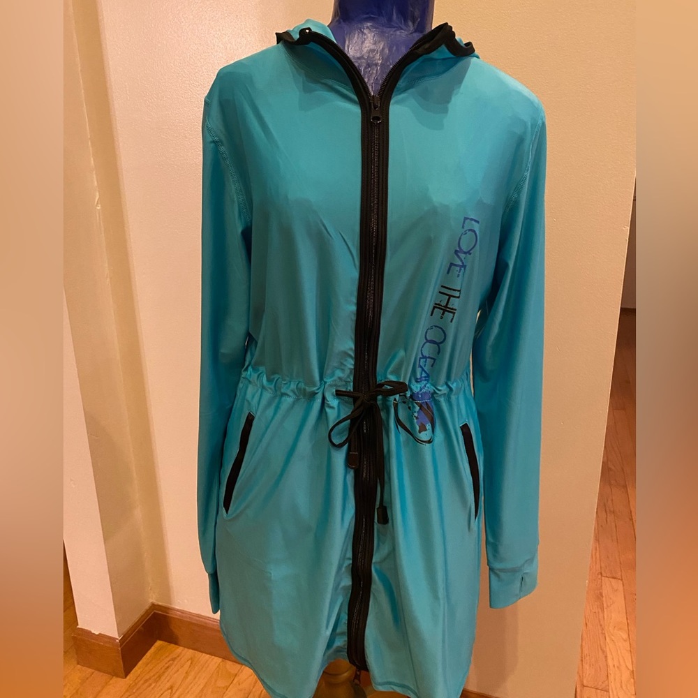 Women’s swimdress Ties around waist. Pocket and hood.